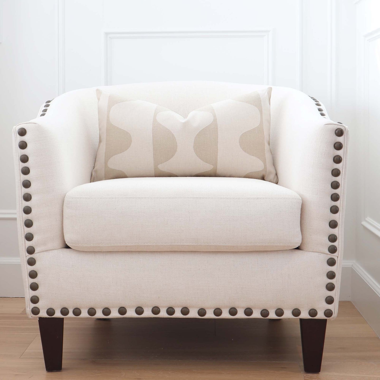 Schumacher Hadiya Williams Drift Hand Painted Wafer Beige and Cream Luxury Designer Throw Pillow Cover on Accent Chair