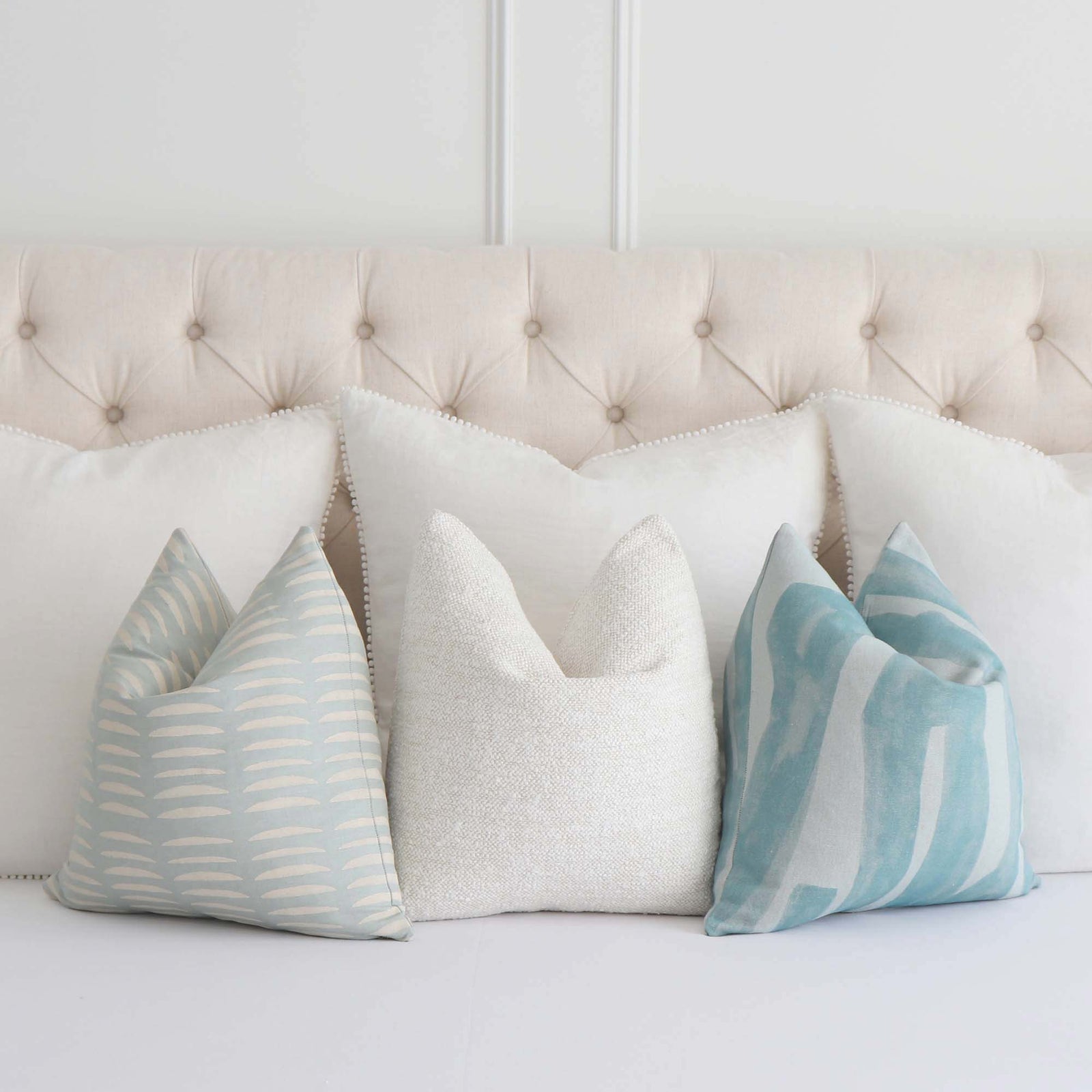 Schumacher Hadiya Williams Luxury Decorative throw pillow cover with wavy hand block pattern on a light blue background with Coordinating Throw Pillows