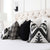 Thibaut Indies Ikat Black Large Scale Bold Graphic Designer Decorative Throw Pillow Cover with Complementing Throw Pillows in Bedroom