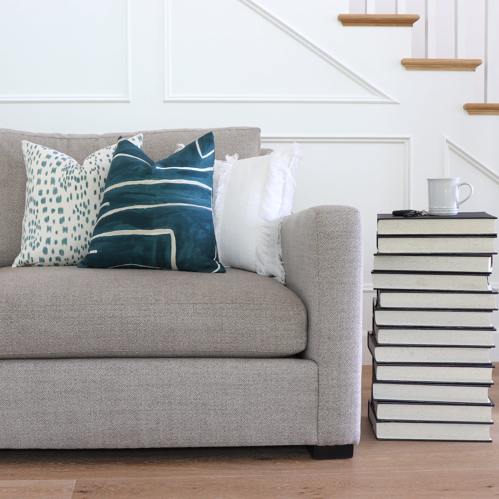 Kelly Wearstler Graffito Teal Throw Pillow Cover on Sofa