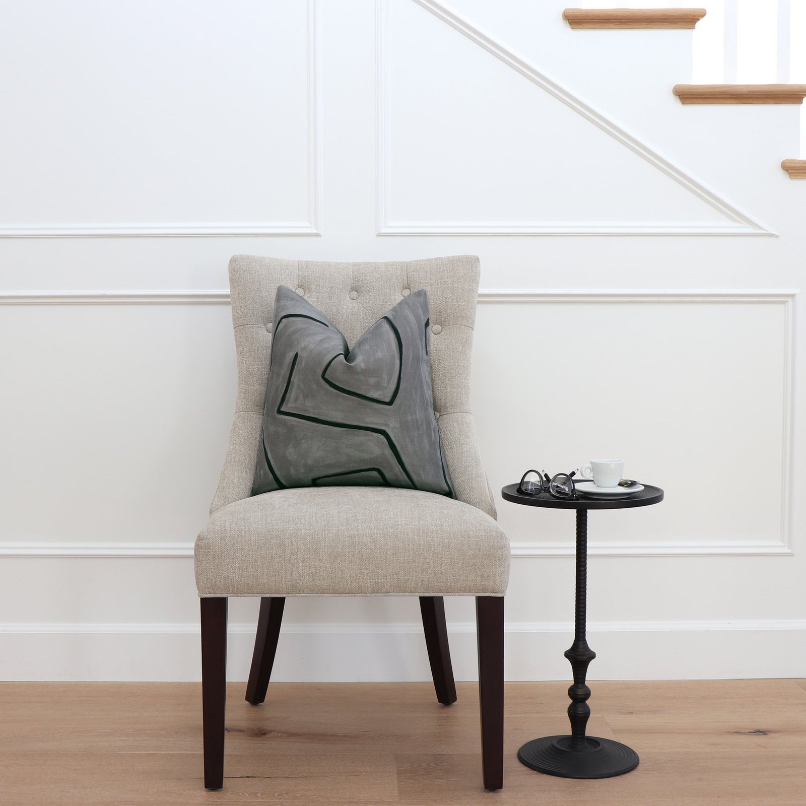 Kelly Wearstler Graffito Graphite Gray Throw Pillow Cover on Chair