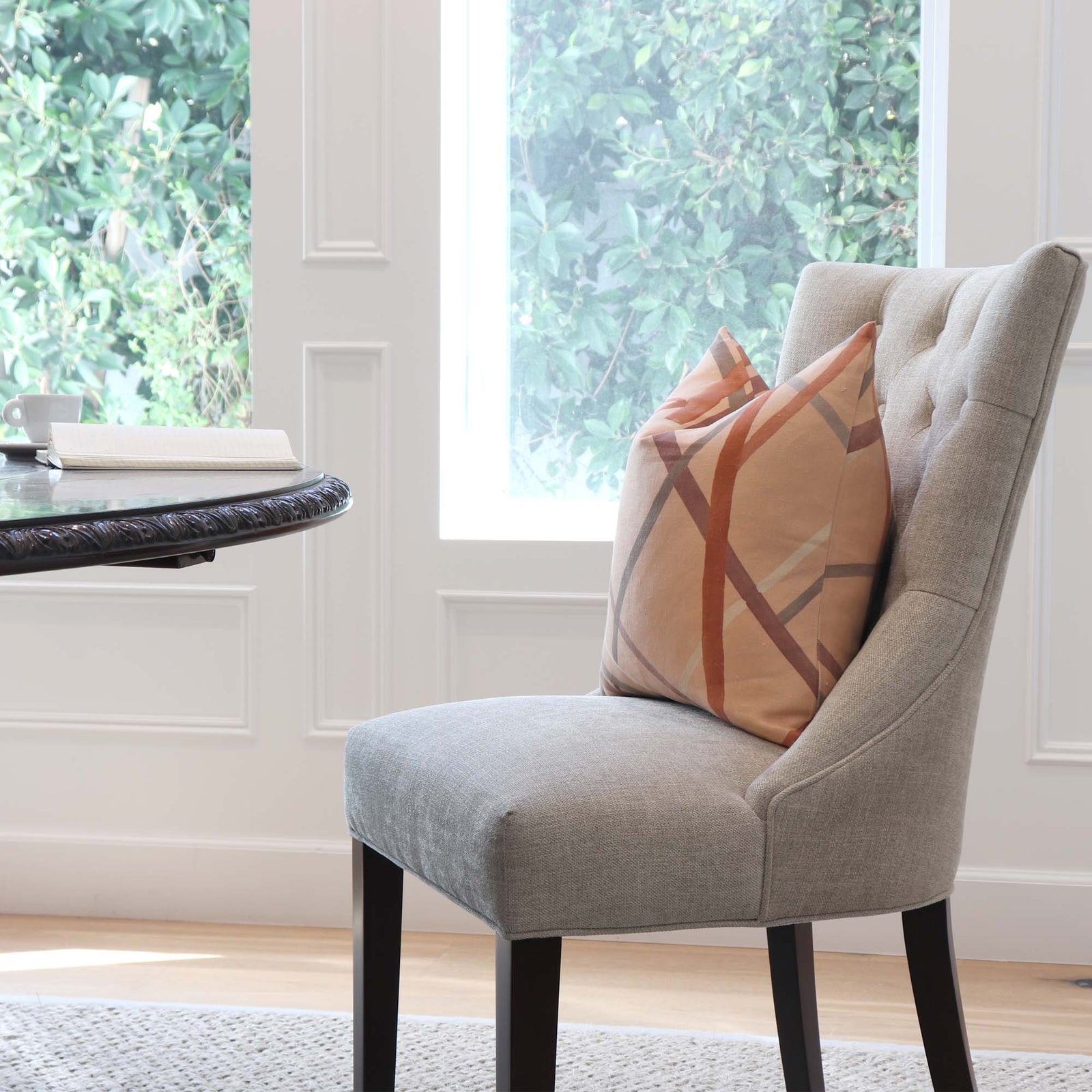 Kelly Wearstler Simpatico Faded Terracotta Striped Designer Decorative Throw Pillow Cover on Dining Chair in Home