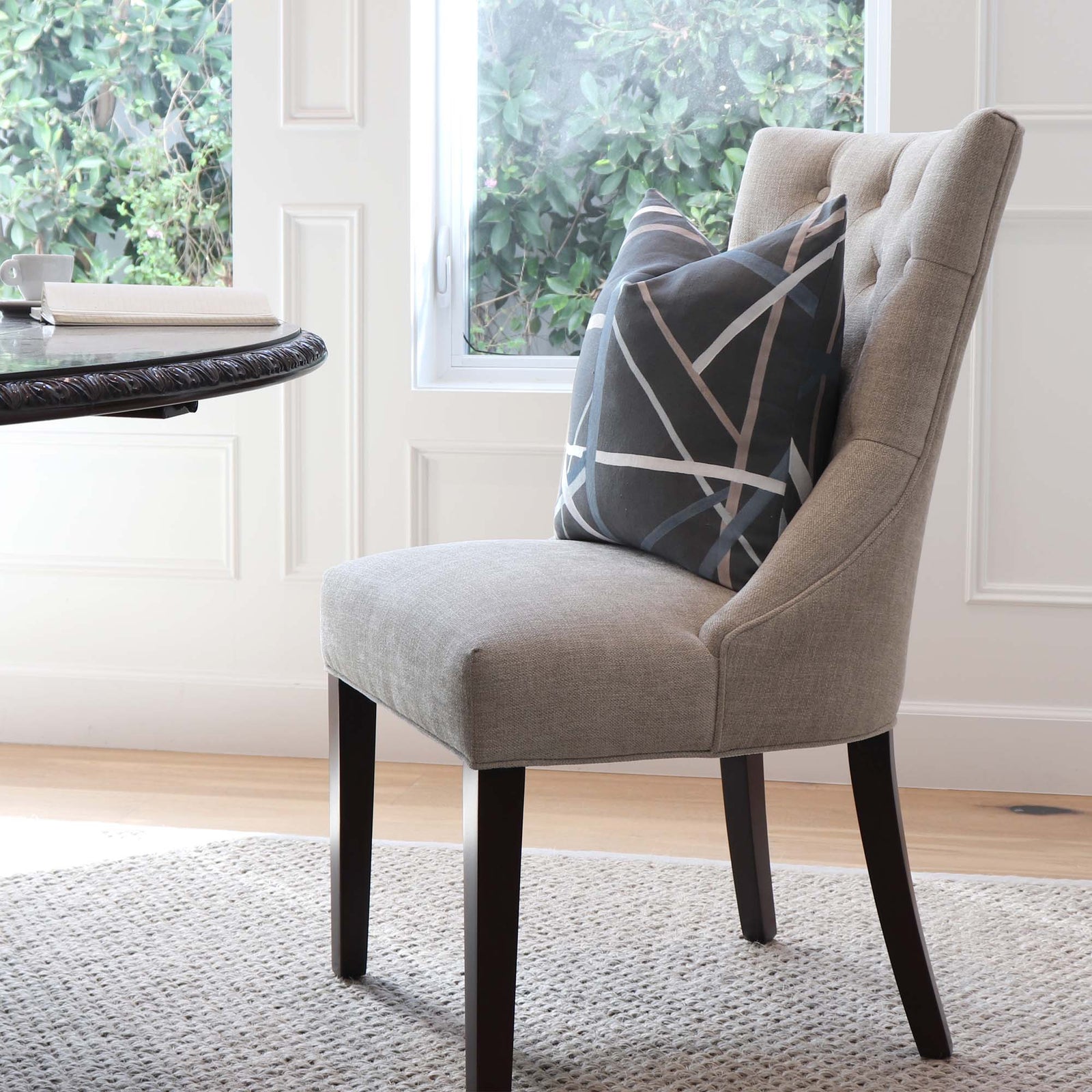 Kelly Wearstler Simpatico Raven Striped Dark Gray Designer Decorative Throw Pillow Cover on Armless Chair in Home