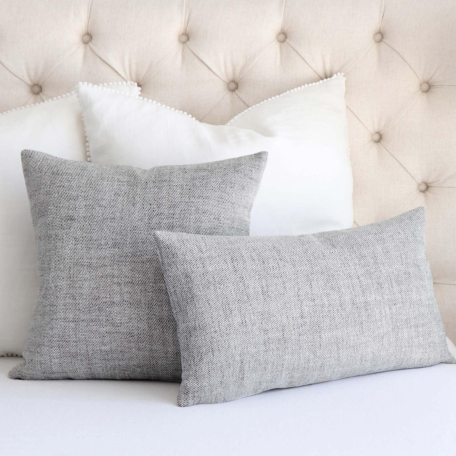 Schumacher Everett Performance Twill Charcoal Black Decorative Designer Throw Pillow Cover on King Bed with White Euro Pillows