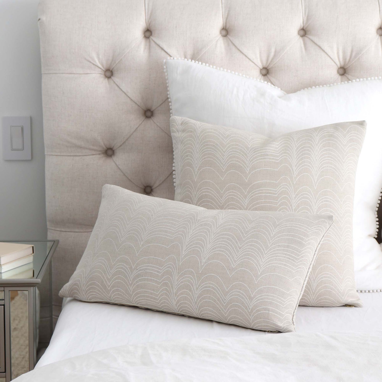 Schumacher Richter Natural and Ivory Striped Designer Throw Pillow Cover on Tufted Bed