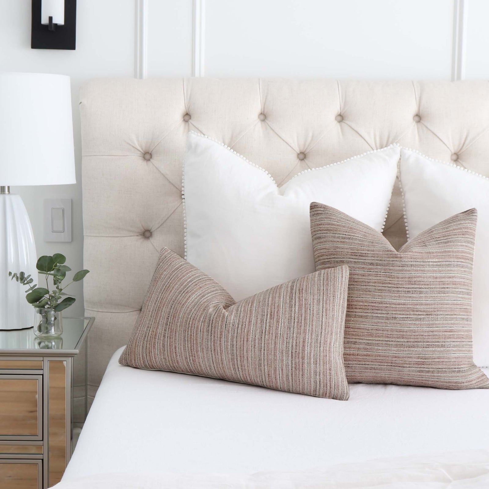 Schumacher Formentera Performance Blush Textured Designer Throw Pillow on Bed