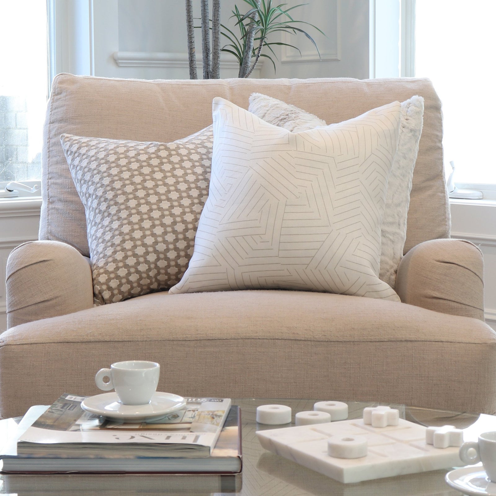 Schumacher Deconstructed Stripe Greige Throw Pillow Cover on Accent Chair