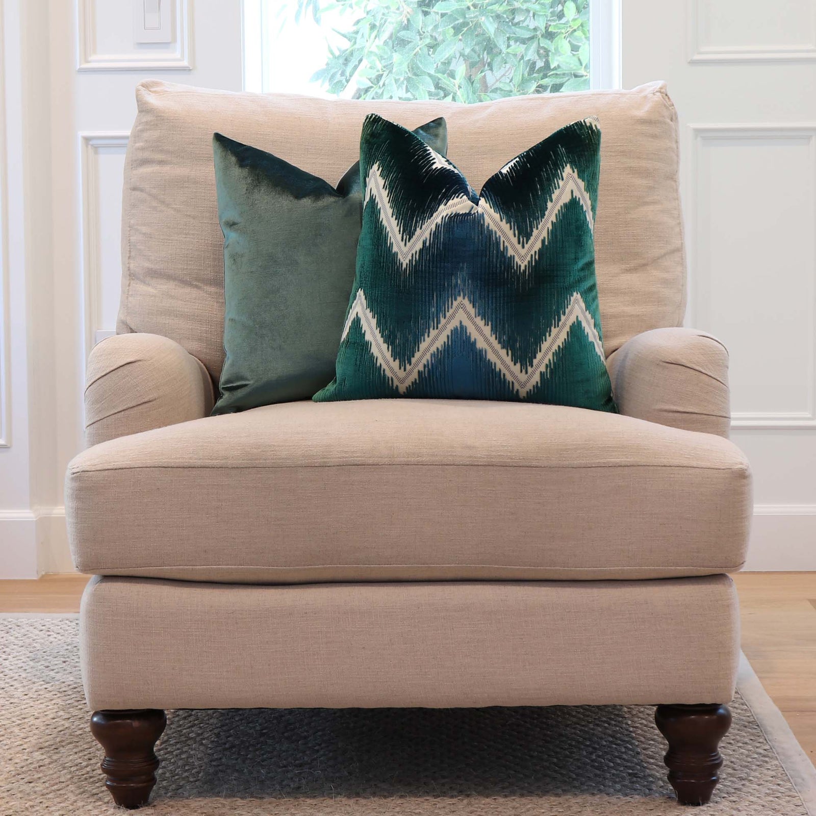 Schumacher Shock Wave Velvet Peacock Designer Throw Pillow Cover on Arm Chair in Living Room