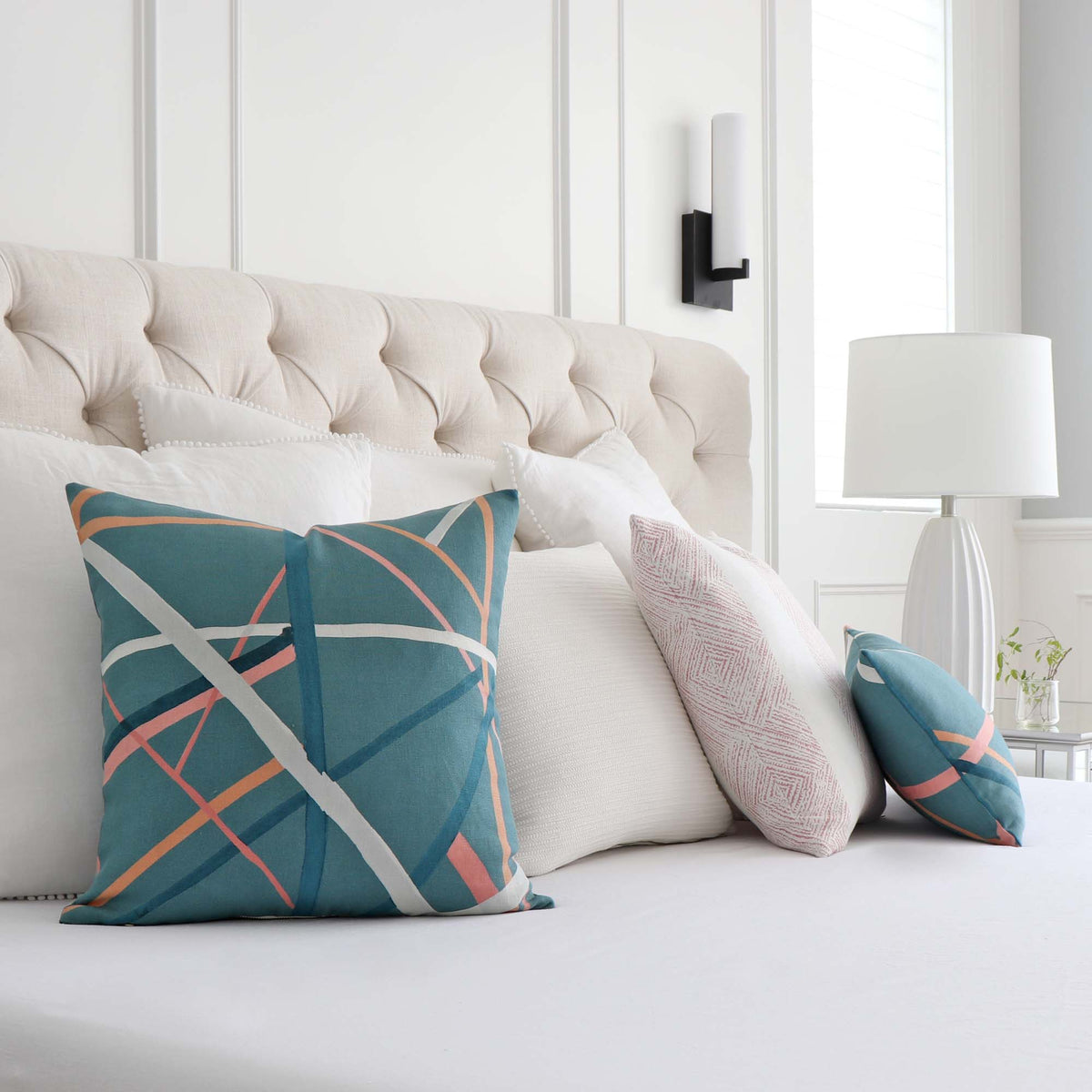 Kelly Wearstle Simpatico Teal Blue Striped Designer Decorative Throw Pillow Cover on King Bed with Coordinating Throw Pillows