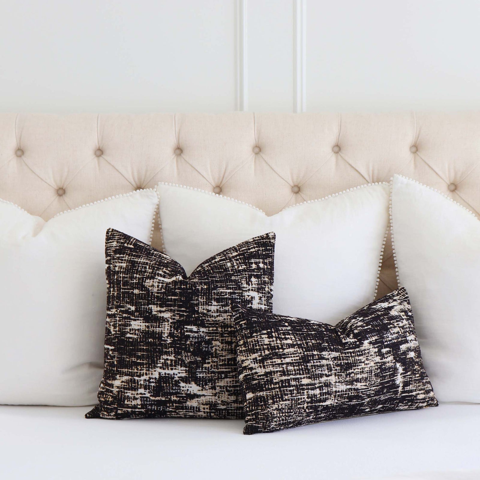 Kelly Wearstler Whisk Shadow Black Textured Designer Luxury Throw Pillow Cover on Bed