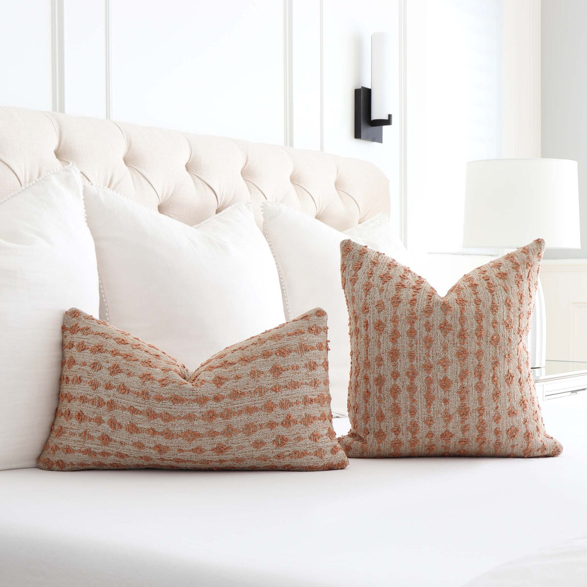 Kelly Wearstler Serai Bouclé Spice Blush Textured Stipe Luxury Designer Throw Pillow Cover on Bed in Bedroom
