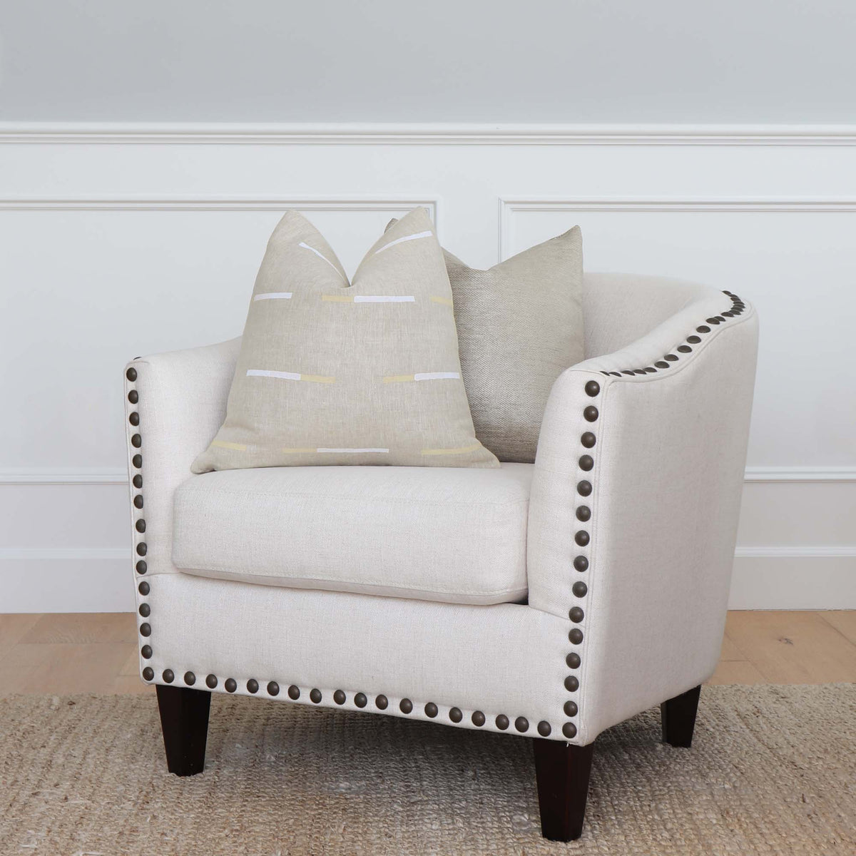 Schumacher x Caroline Z Hurley Overlapping Dashes in Bluff Striped Designer Throw Pillow Cover on Accent Chair with Complementing Throw Pillow