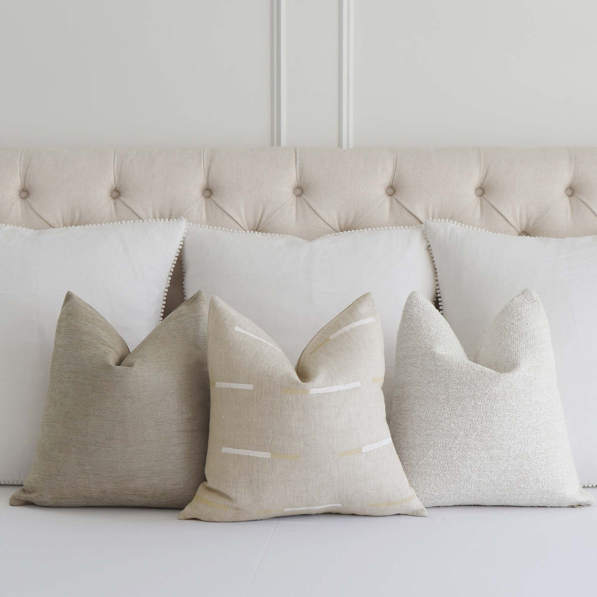 Schumacher x Caroline Z Hurley Overlapping Dashes in Bluff Striped Designer Throw Pillow Cover with Complementing Throw Pillows on Bed