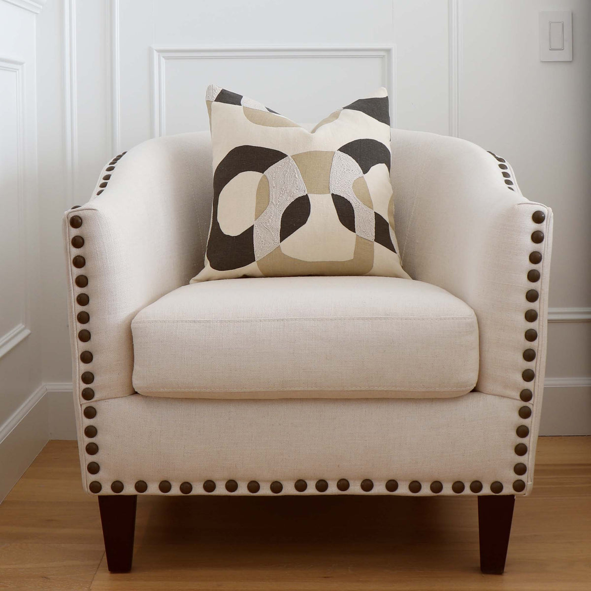 Schumacher Conrad Embroidered Dune Natural Graphic Geometric Designer Throw Pillow Cover on Accent Chair