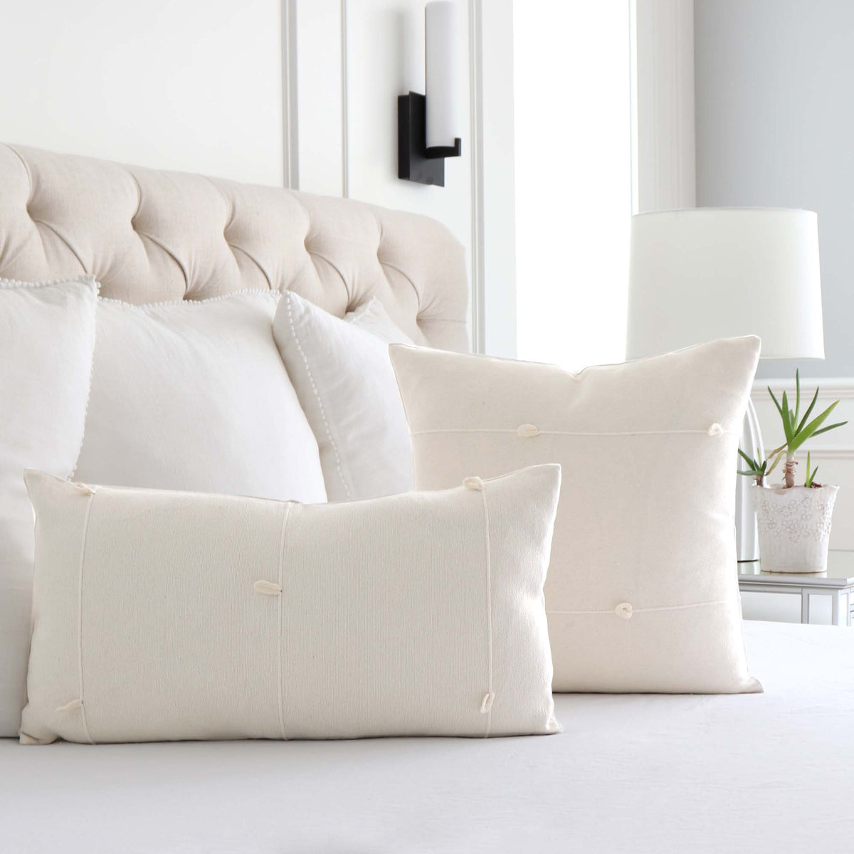 Schumacher Globo Knotted Handwoven Natural White Designer Textured Throw Pillow Cover in Bedroom