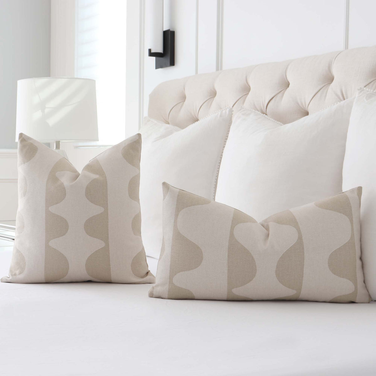 Schumacher Hadiya Williams Drift Hand Painted Wafer Beige and Cream Luxury Designer Throw Pillow Cover in Bedroom on Bed