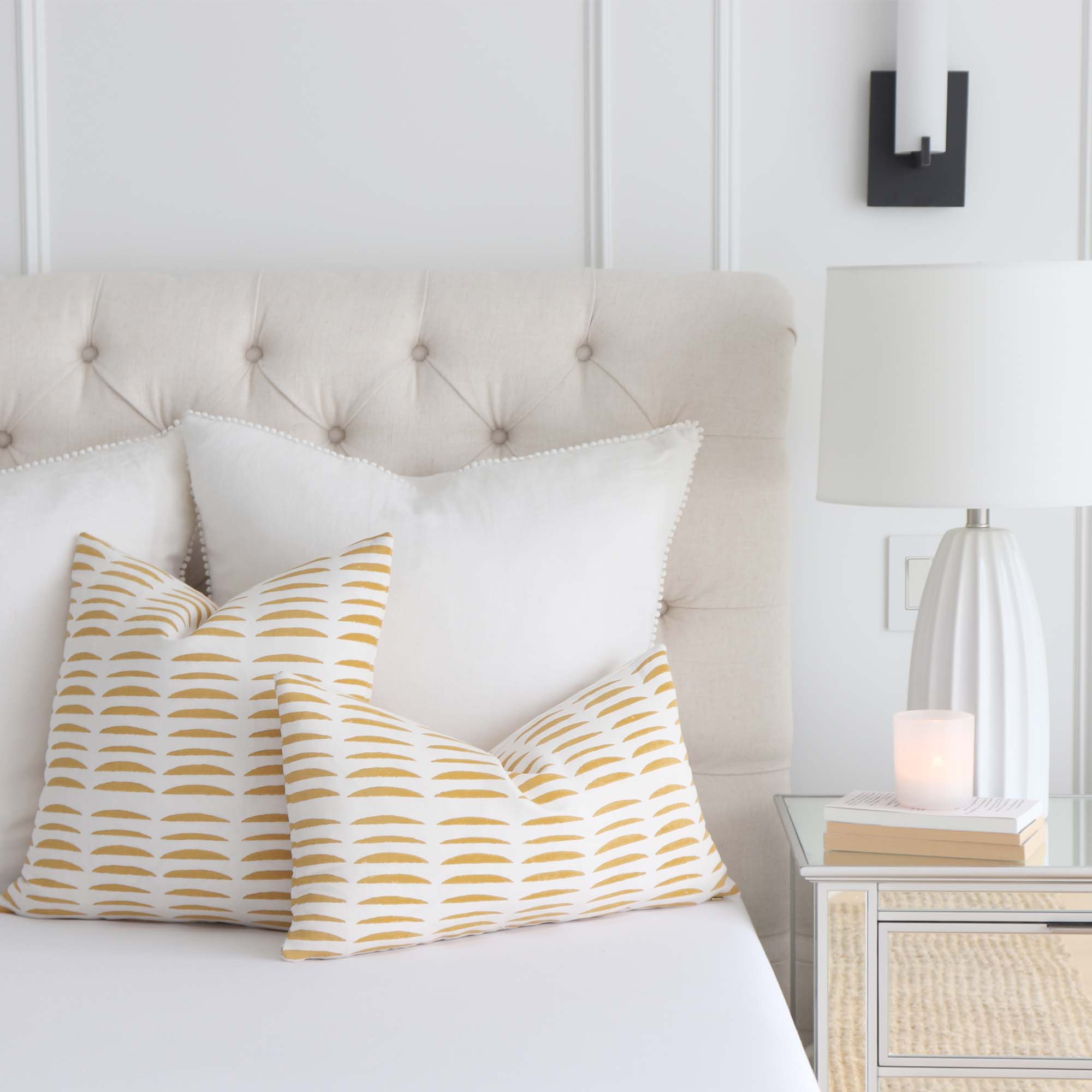 Schumacher Hadiya Williams Parable Hand Stamped Block Ginger Yellow Abstract Stripe Luxury Throw Pillow Cover in Bedroom on Bed