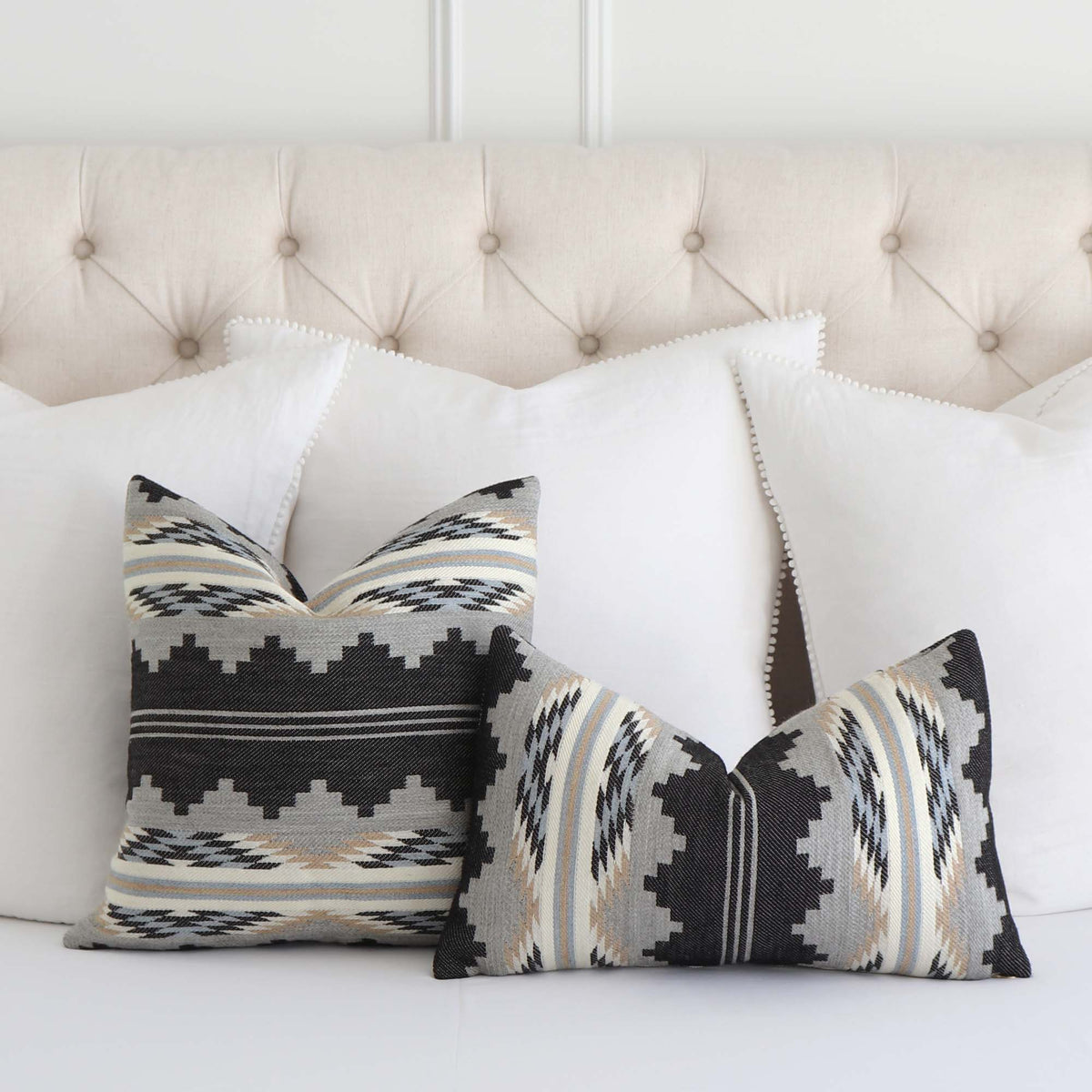 Schumacher Monsoon Navy Blue Wool Southwestern Style Designer Luxury Geometric Throw Pillow Cover on Bed With Large White Sham Pillows