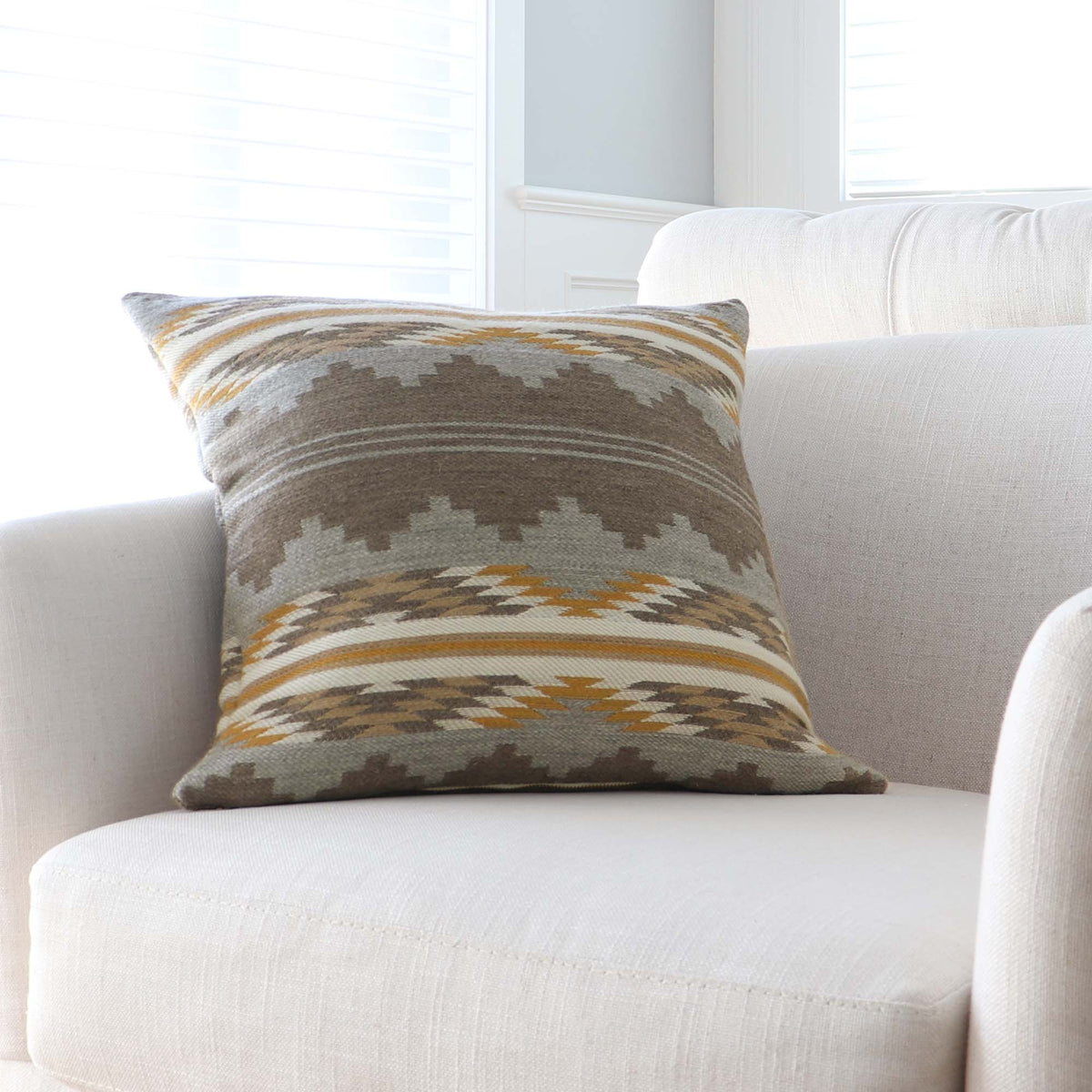 Schumacher Monsoon Neutral Burnt Orange Southwestern Geometric Wool Luxury Designer Throw Pillow Cover on Accent Chair in Home