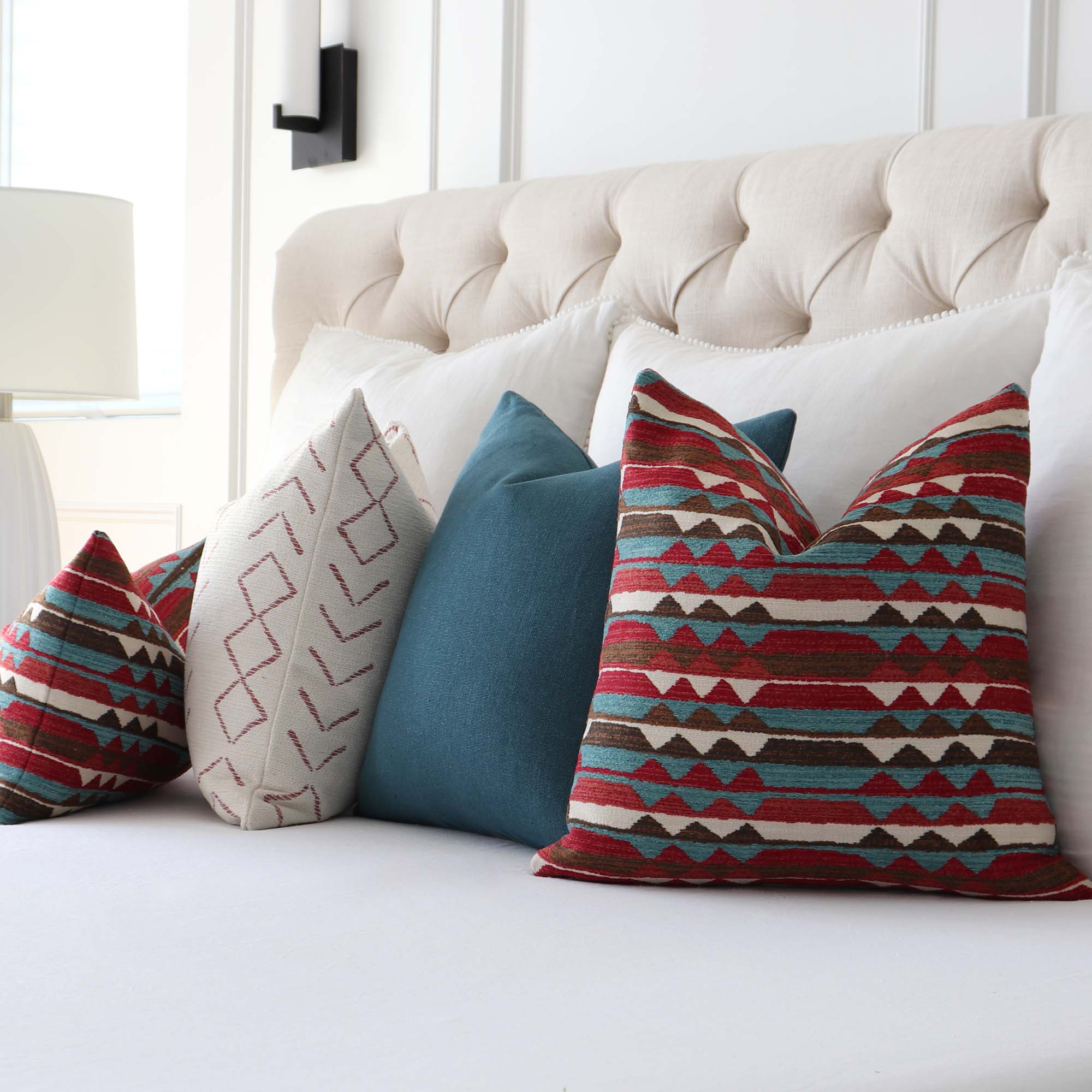 https://www.chloeandolive.com/cdn/shop/files/Thibaut_InsideOut_Performance_Fabric_Saranac_Redwood_Red_Turquoise_Blue_Woven_Ikat_Kilim_Patttern_Designer_Luxury_Throw_Pillow_Cover_with_Matching_Throw_Pillows_in_Bedroom_5000x.jpg?v=1692676037