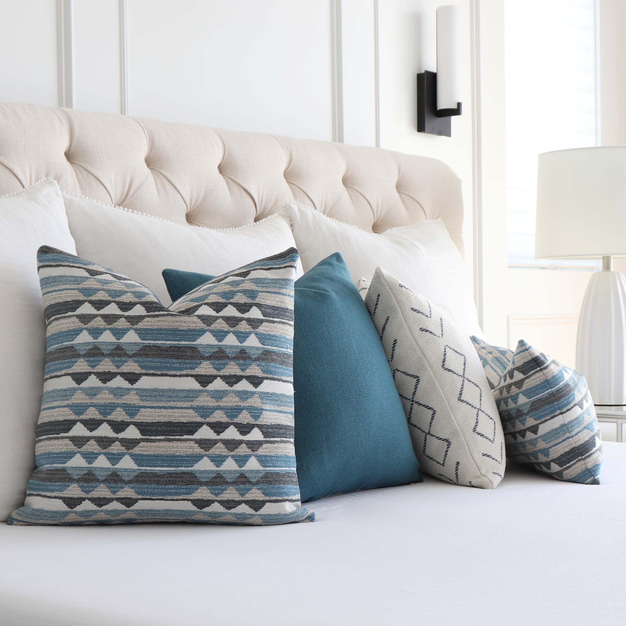https://www.chloeandolive.com/cdn/shop/files/Thibaut_InsideOut_Performance_Fabric_Saranac_Waterfall_Blue_Woven_Ikat_Kilim_Patttern_Designer_Luxury_Throw_Pillow_Cover_in_Bedroom_with_Matching_Throw_Pillows_2000x.jpg?v=1692677727