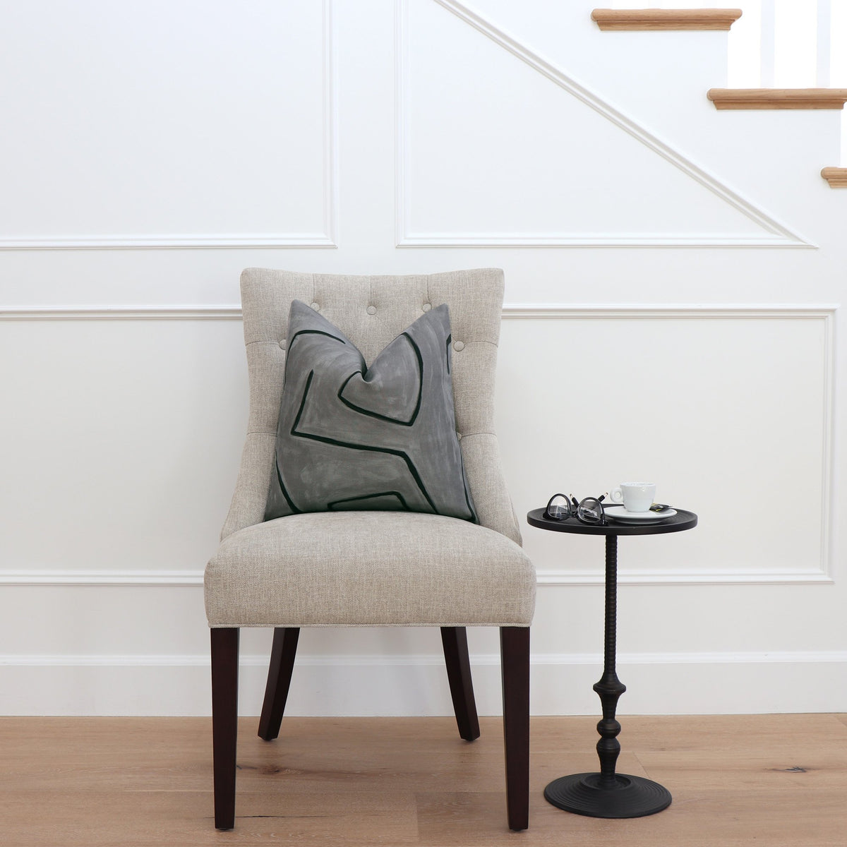 Kelly Wearstler Graffito Graphite Gray Throw Pillow Cover on Chair