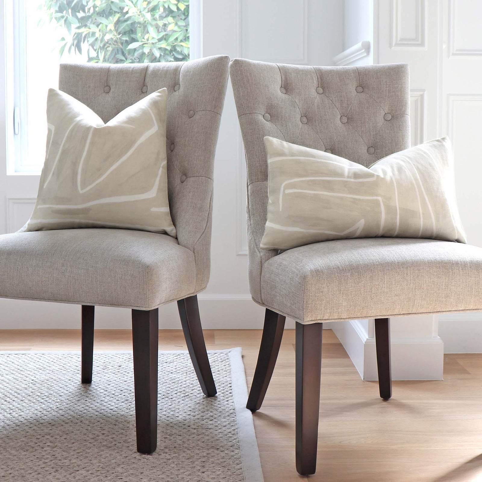 Graffito Kelly Wearstler Beige Geometric Throw Pillow Cover on Dining Chair