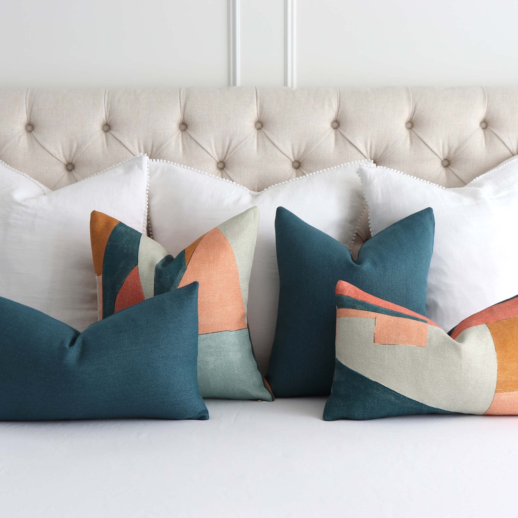 https://www.chloeandolive.com/cdn/shop/products/Kelly-Wearstler-District-Apricot-Designer-Luxury-Throw-Pillow-Cover-GWF-3752.357.0_bed_tealPillows_2000x.jpg?v=1627175043