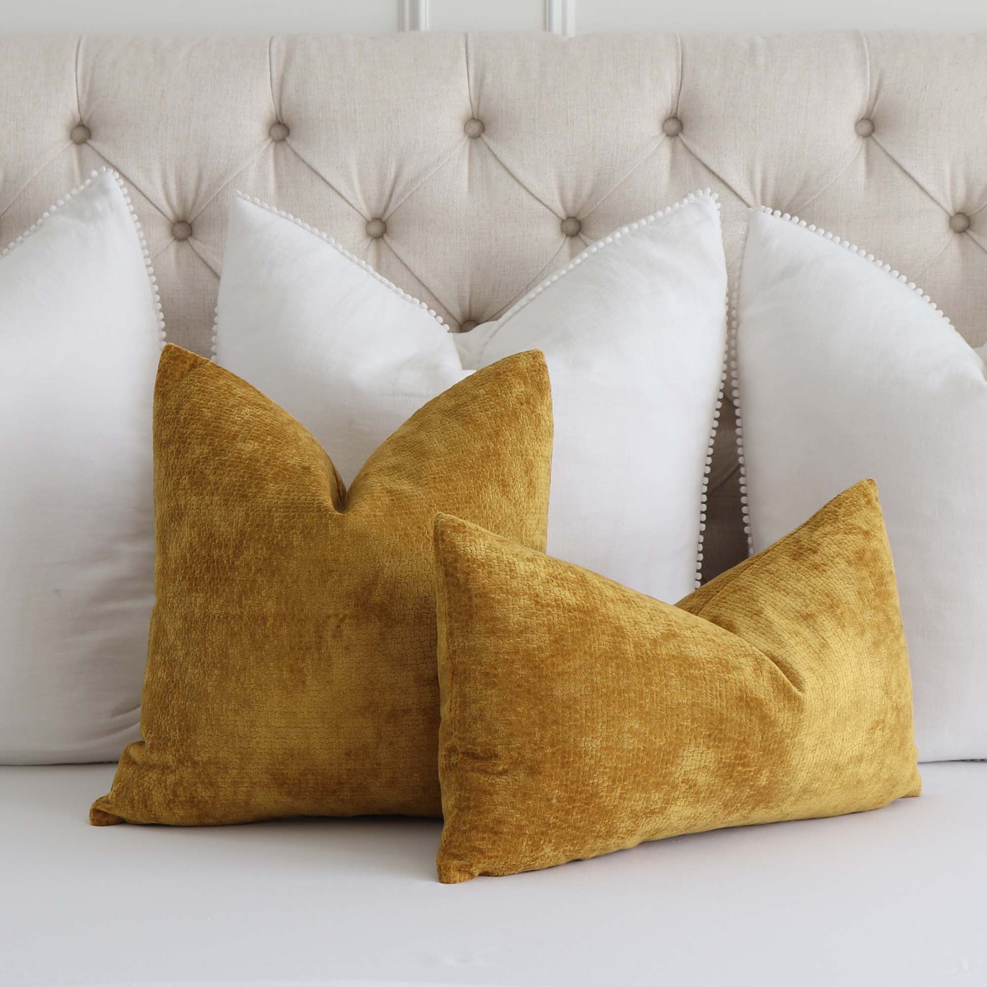 Kelly Wearstler Lee Jofa Rebus Glint Gold Textured Velvet Designer Throw Pillow Cover with White Euro Throw Pillows on Queen Bed