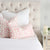 Les Touches Petal Pink Designer Throw Pillow Cover in Bedroom
