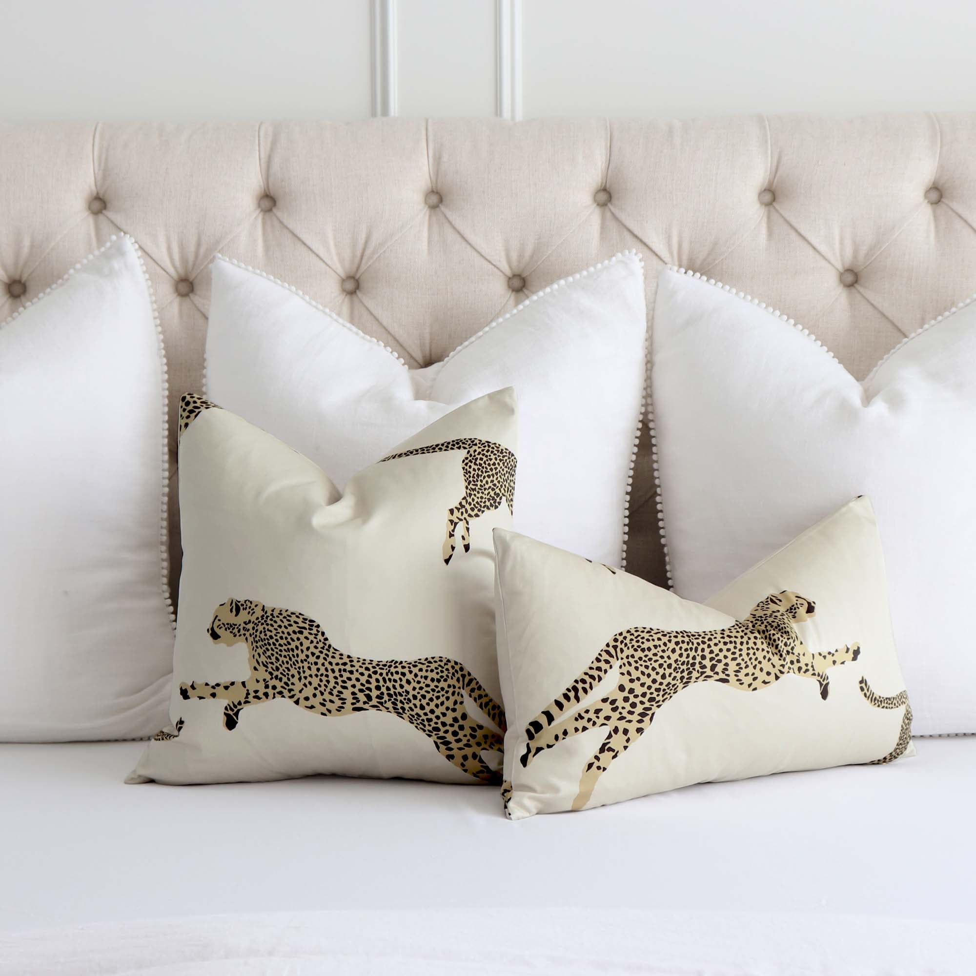 https://www.chloeandolive.com/cdn/shop/products/Scalamandre-Leaping-Cheetah-Dune-Beige-SC000116634-Animal-Print-Designer-Luxury-Decorative-Throw-Pillow-Cover_scenic_bed_2000x.jpg?v=1652416026