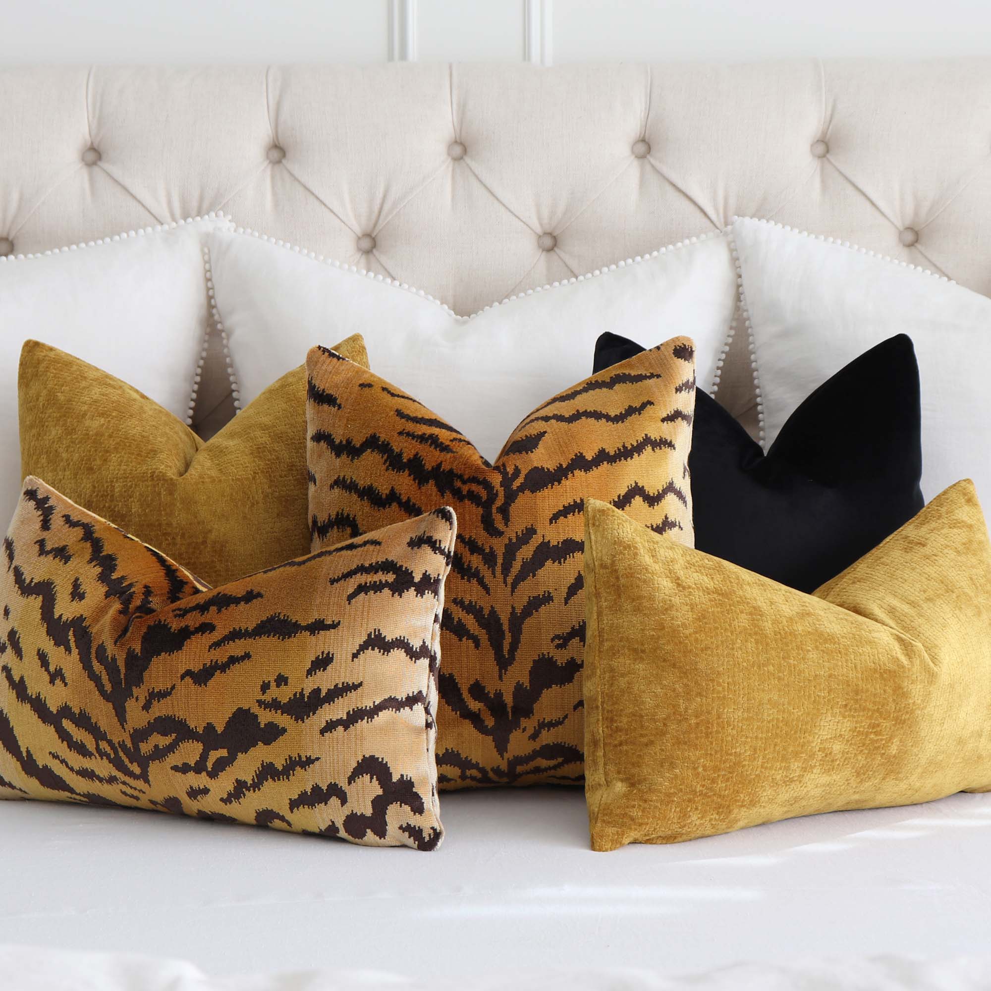 https://www.chloeandolive.com/cdn/shop/products/Scalamandre-Tigre-Silk-Velvet-Gold-Animal-Print-Luxury-Decorative-Designer-Throw-Pillow-Cover-on-King-Bed-with-Luxurious-Throw-Pillows_5000x.jpg?v=1675053984