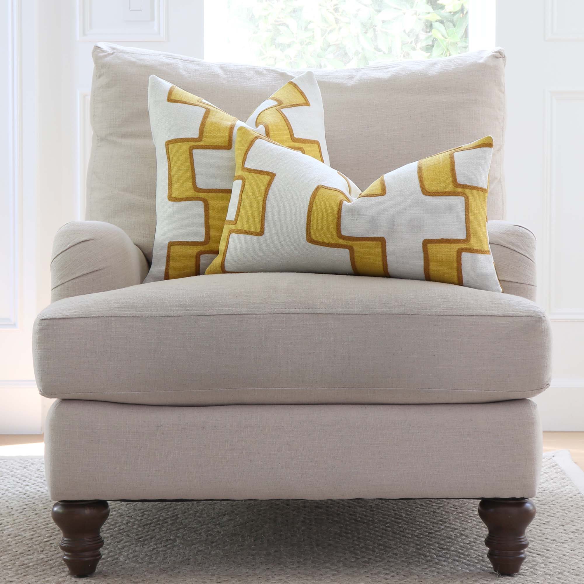 https://www.chloeandolive.com/cdn/shop/products/Schumacher-Dixon-Embroidered-Print-Linen-Luxury-Designer-Throw-Pillow-Cover-on-Accent-Chair-in-Living-Room_5000x.jpg?v=1633021338
