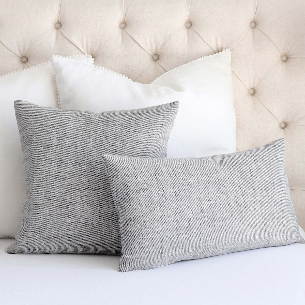 Schumacher Everett Performance Twill Charcoal Black Decorative Designer Throw Pillow Cover on King Bed with White Euro Pillows