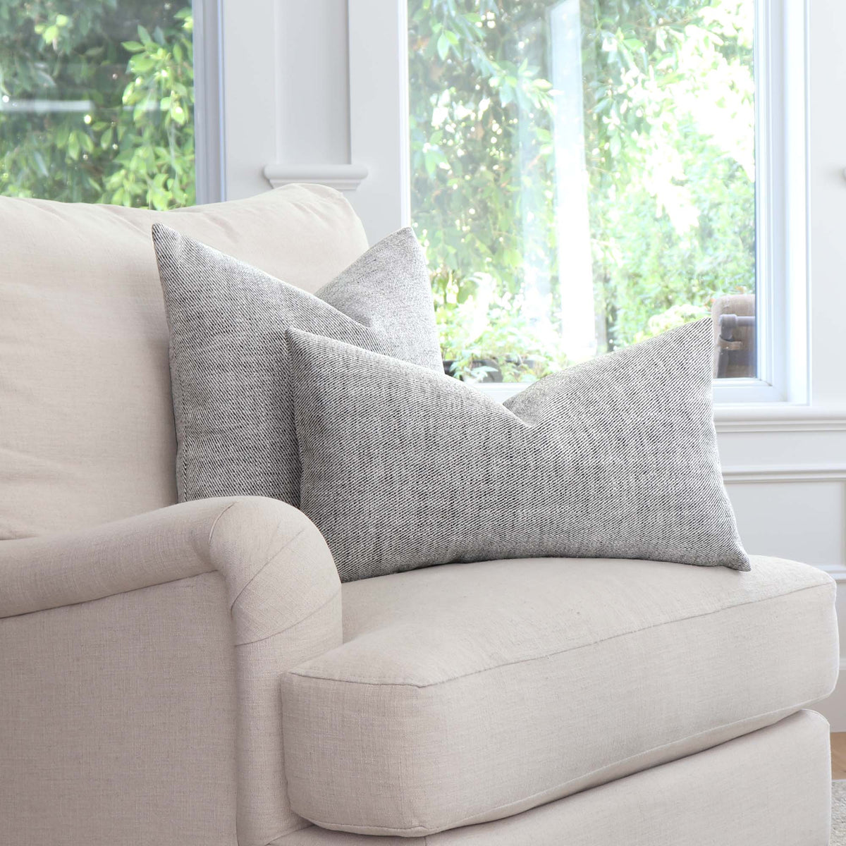 Schumacher Everett Performance Twill Charcoal Black Decorative Designer Throw Pillow Cover on Arm Chair in Home Decor