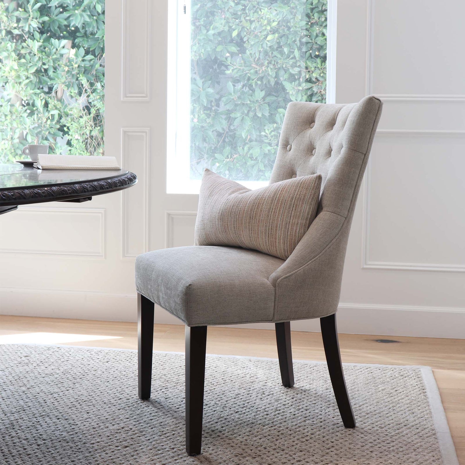 Schumacher Formentera Performance Blush Textured Designer Lumbar Throw Pillow on Armless Chair in Home