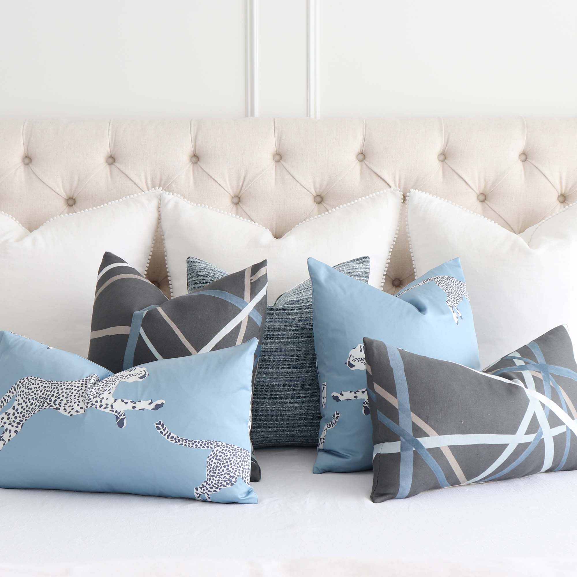 Schumacher Formentera Denim Textured Stripe Decorative Throw Pillow Cover with Matching Throw Pillows on Bed