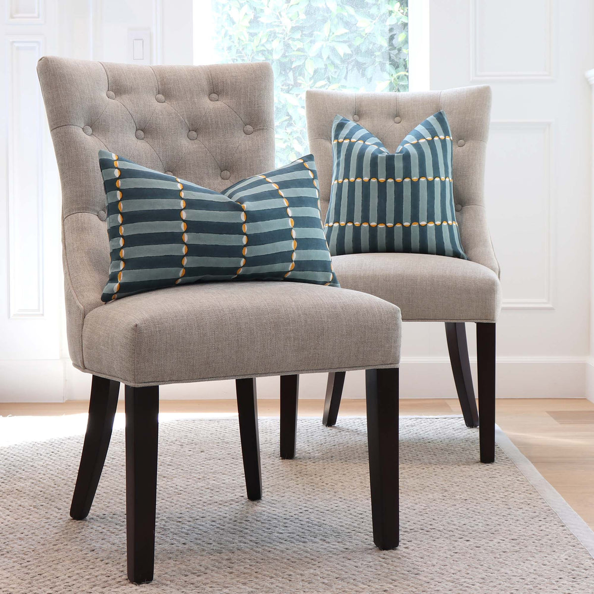 Schumacher Luna Blue and Turmeric Graphic Block Print Designer Decorative Throw Pillow Cover on Dining Room Chairs