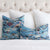 Schumacher Rolling Hills Blue Designer Throw Pillow Cover on King Bed with White Pom Euro Shams