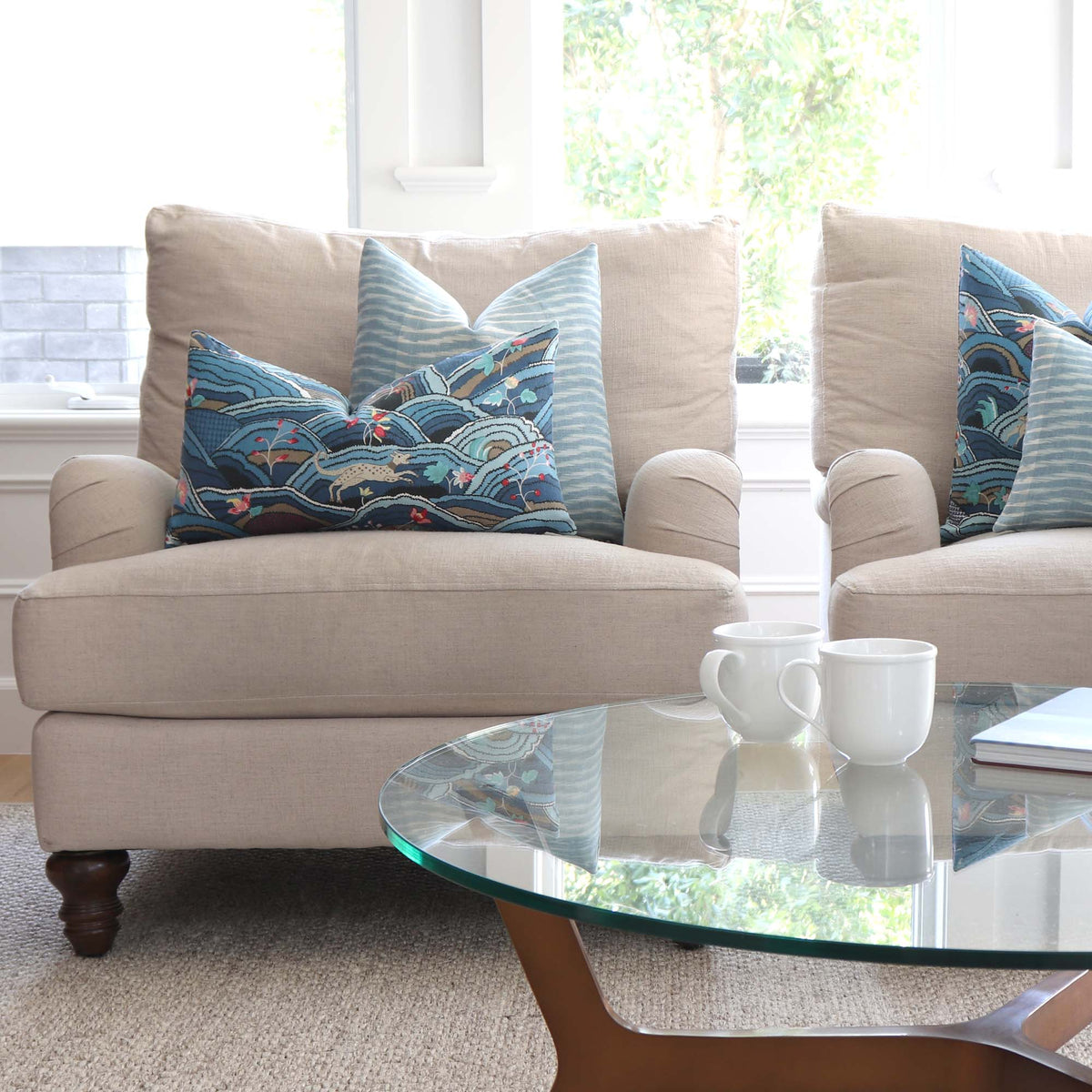 Schumacher Rolling Hills Blue Designer Throw Pillow Cover on Big Comfy Arm Chairs