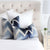 Schumacher Shock Wave Velvet Midnight Blue Designer Throw Pillow on King Bed