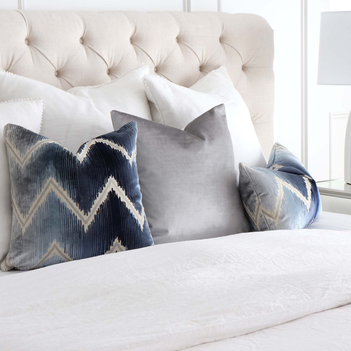 Schumacher Shock Wave Velvet Midnight Blue Designer Throw Pillow in Bedroom