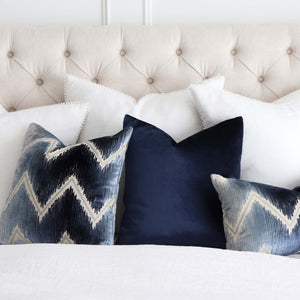 Schumacher Shock Wave Velvet Midnight Blue Designer Throw Pillow with Blue Velvet Pillow on Bed