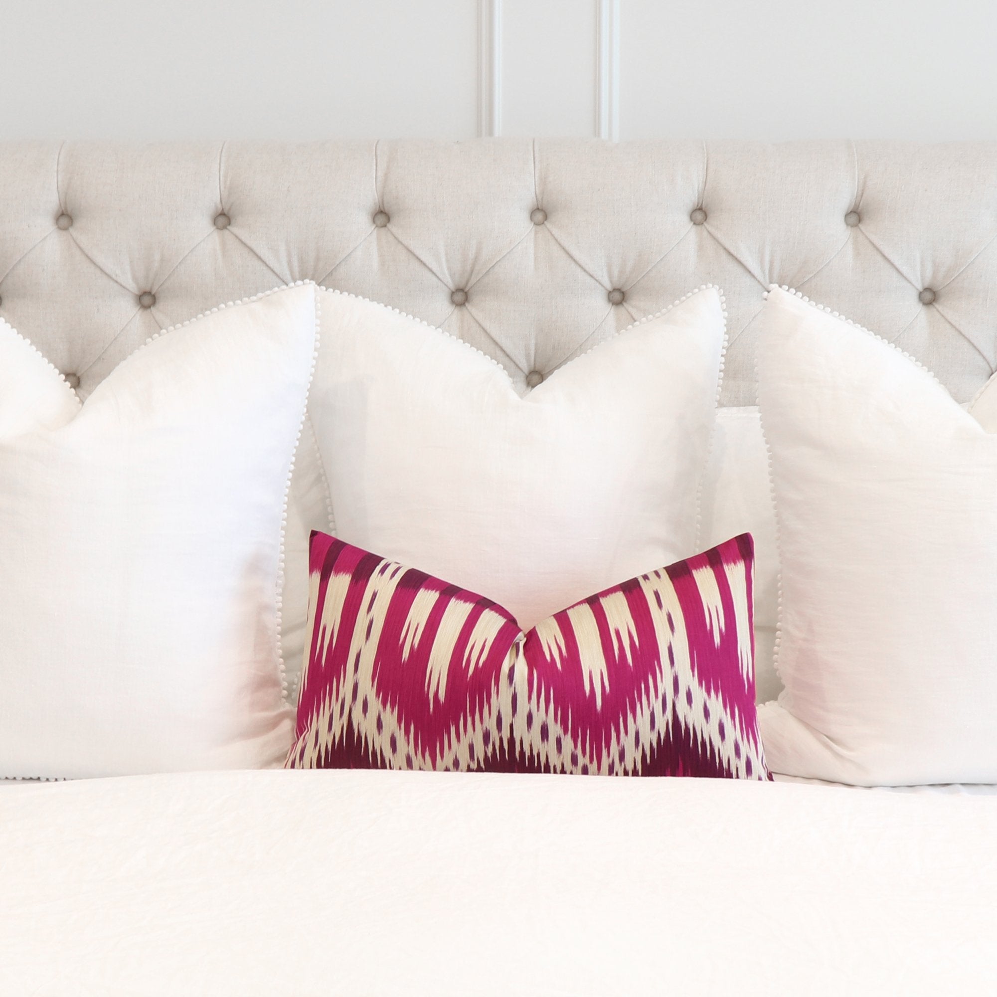 Schumacher Bukhara Ikat Fuchsia Pink Lumbar Pillow Cover in Bedroom