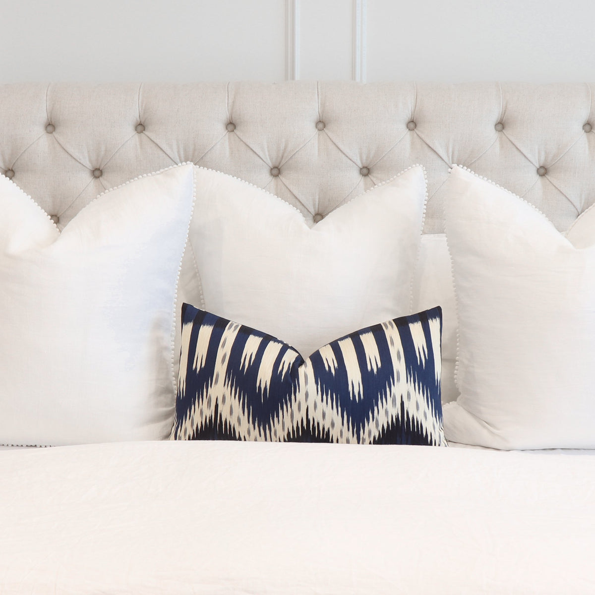 Schumacher Bukhara Ikat Indigo Lumbar Throw Pillow Cover in Bedroom