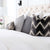 Schumacher Shock Wave Velvet Platinum Black Designer Throw Pillow Cover in Bedroom