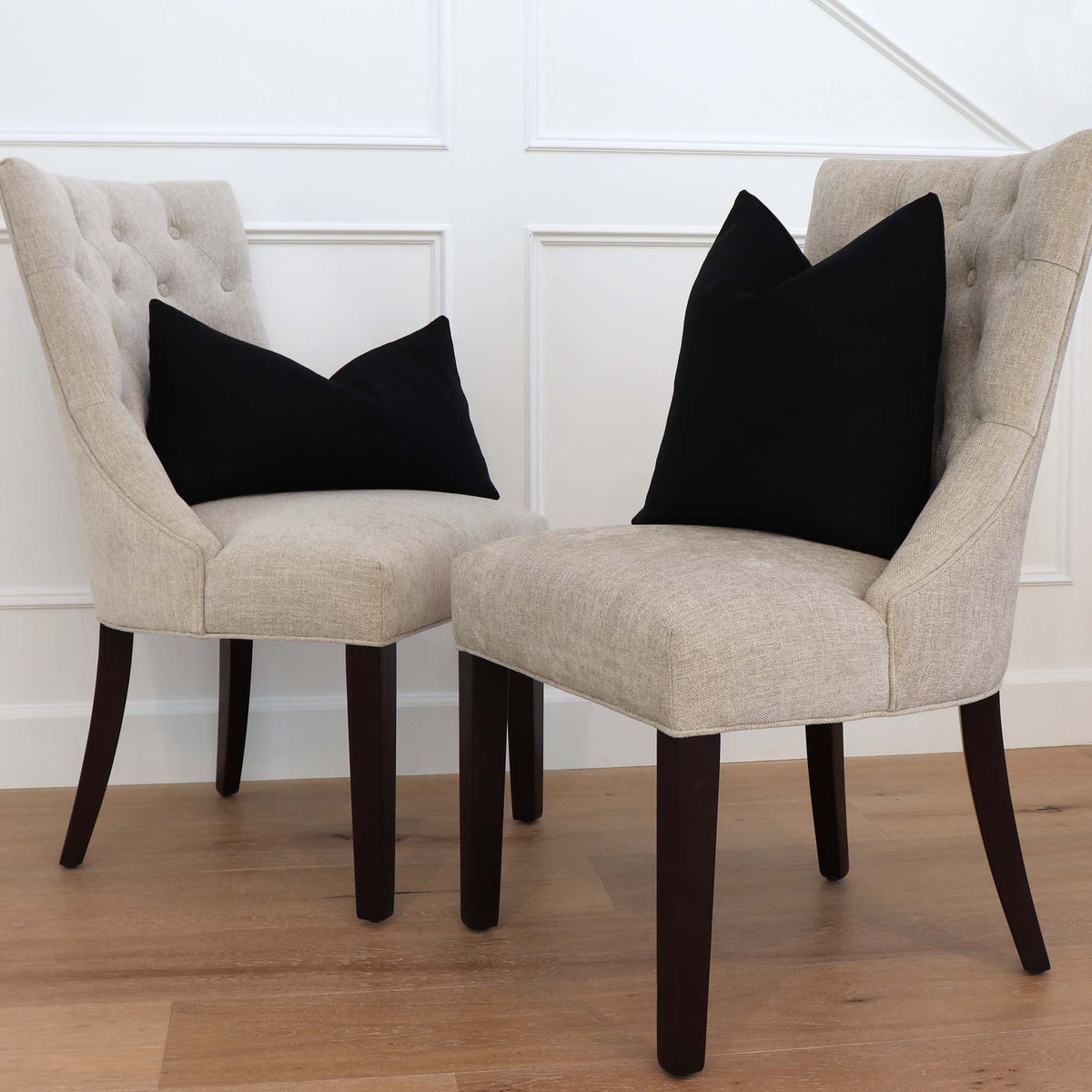 Tay Solid Black Linen Throw Pillow Cover on Chair in Home