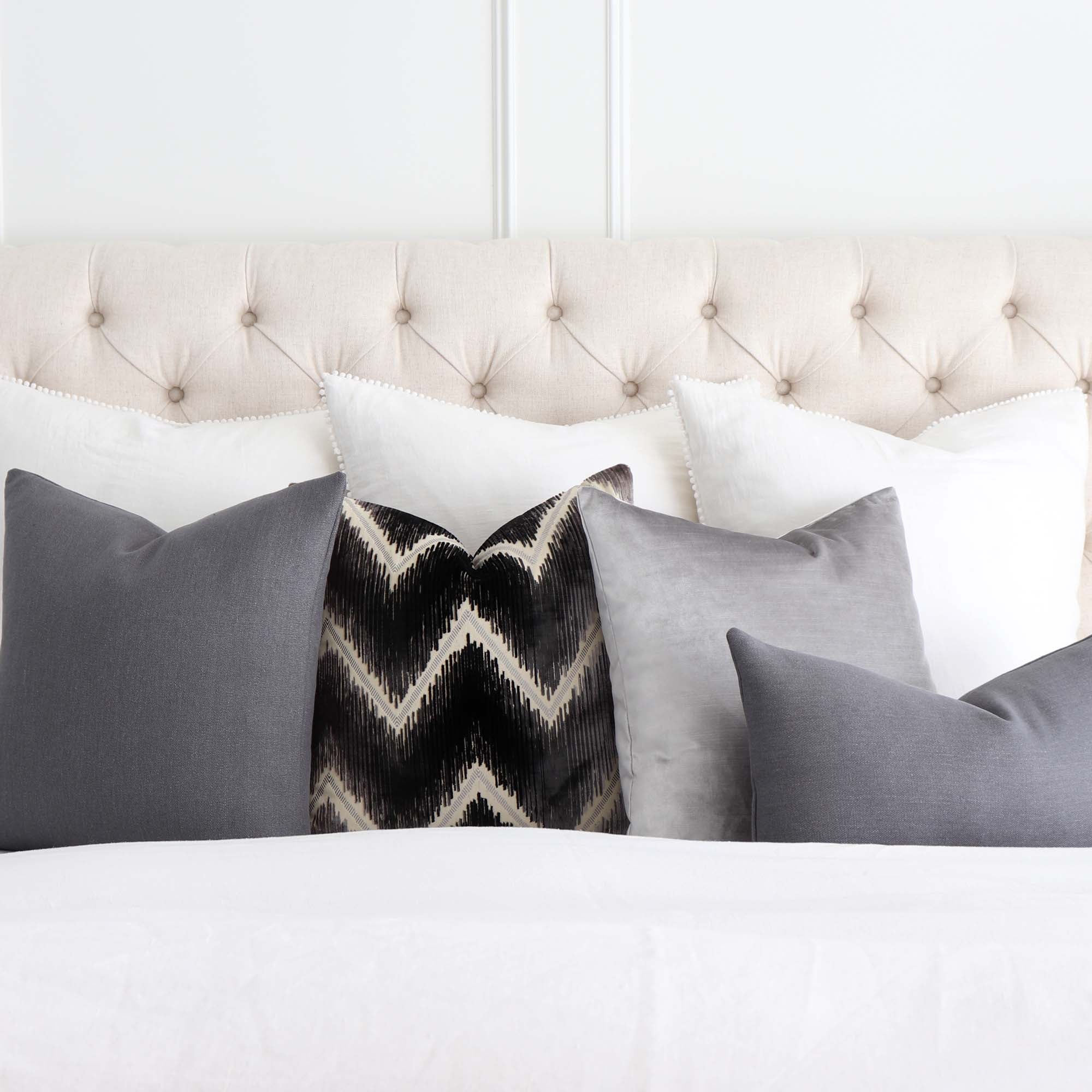 https://www.chloeandolive.com/cdn/shop/products/Tay-Gustave-Dark-Gray-Solid-Color-Linen-Designer-Throw-Pillow-Cover-On-Bed-With-White-Linen-Bedding_5000x.jpg?v=1616261736