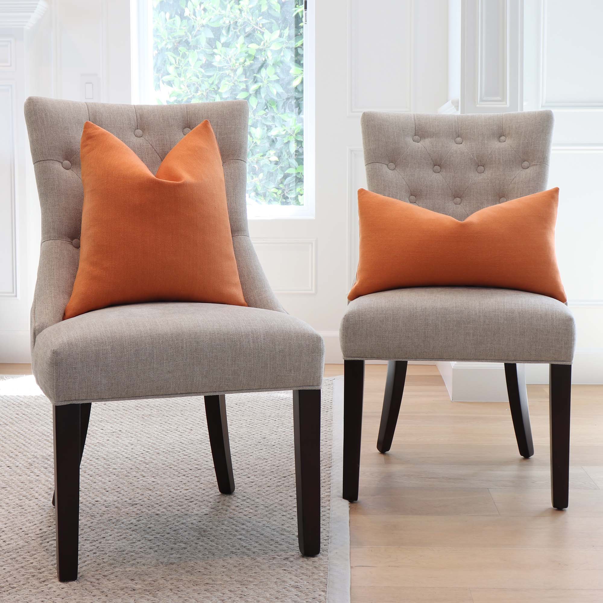 https://www.chloeandolive.com/cdn/shop/products/Tay-Pumpkin-Orange-Solid-Linen-Decorative-Throw-Pillow-Cover-on-Dining-Chairs-in-Home_5000x.jpg?v=1651120237