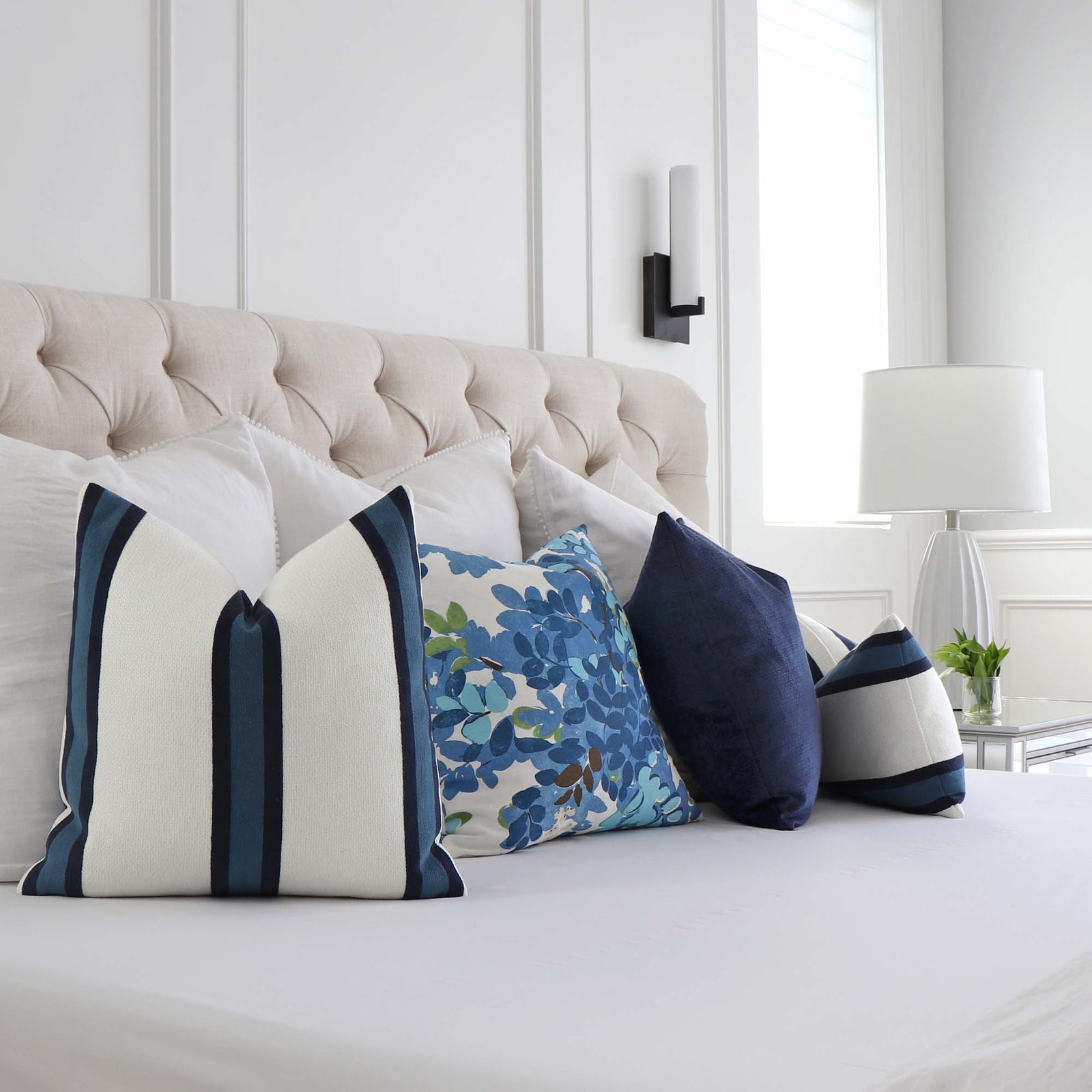https://www.chloeandolive.com/cdn/shop/products/Thibaut-Abito-Navy-Blue-Stripe-W77142-Designer-Luxury-Throw-Pillow-Cover_scenic_pillowscape_1600x.jpg?v=1662691822